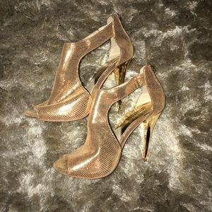 Michael Kors gold heels.